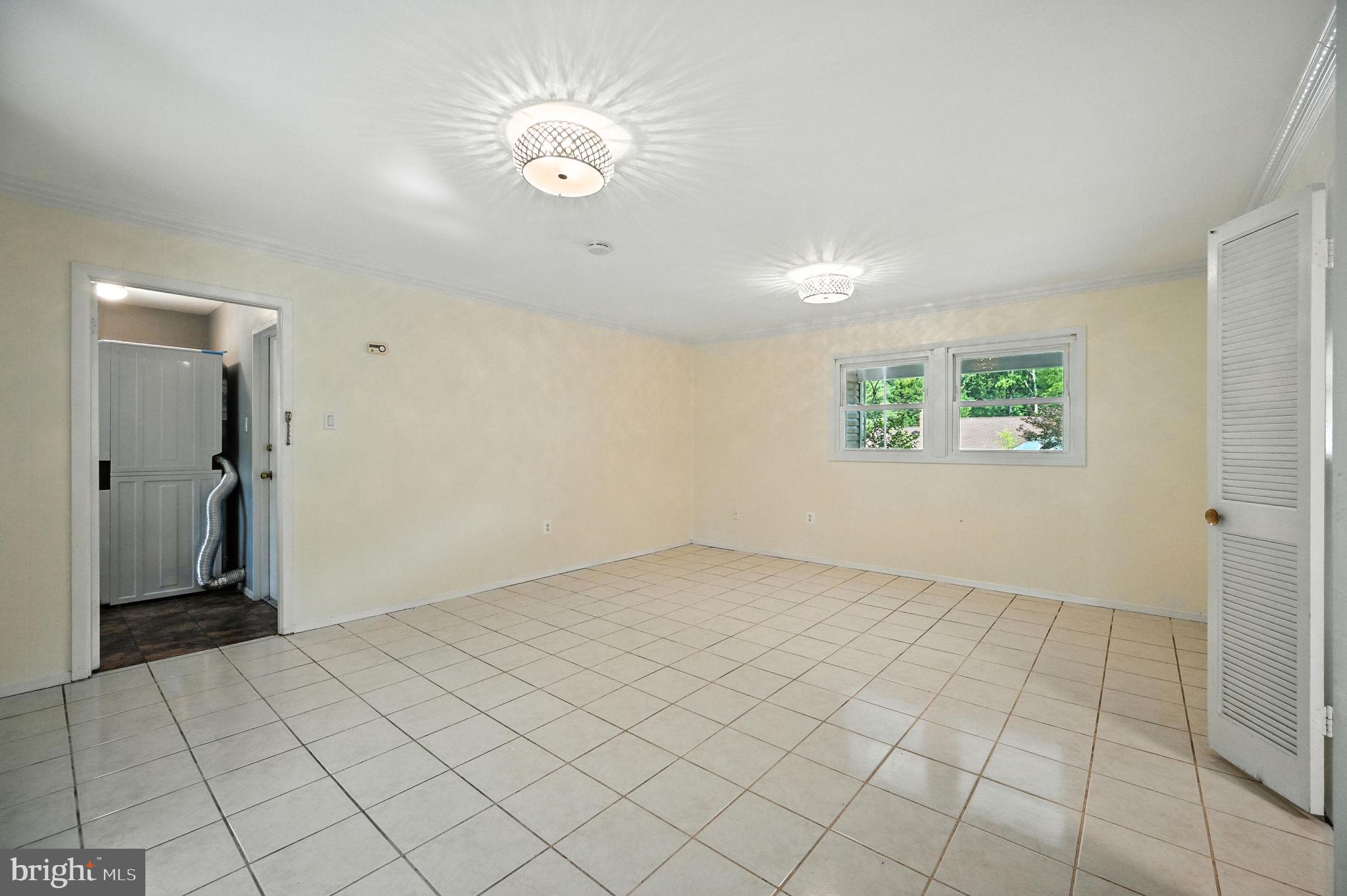 9301 Montpelier Drive Laurel, MD 20708 - Photo 19 of 23 a view of an empty room and window