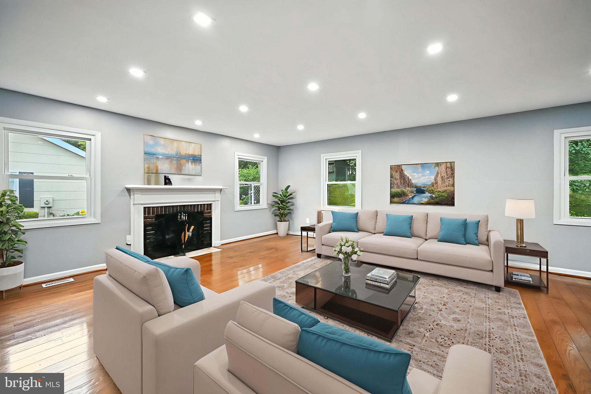 9301 Montpelier Drive Laurel, MD 20708 - Photo 3 of 23 a living room with furniture and a fireplace