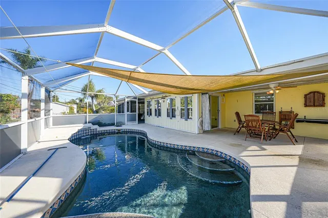 a view of a swimming pool with a patio