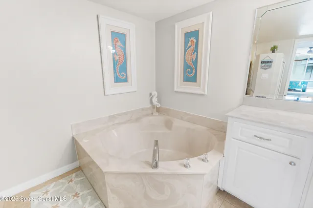 a white bath tub sitting in a bathroom