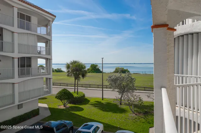 a view of a house with backyard and outdoor seating