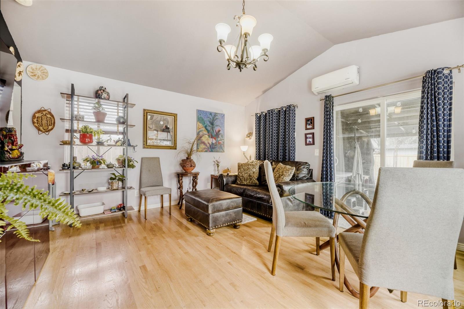 2520 North Locust Street Denver, CO 80207 - Photo 16 of 39 a living room with furniture and a chandelier