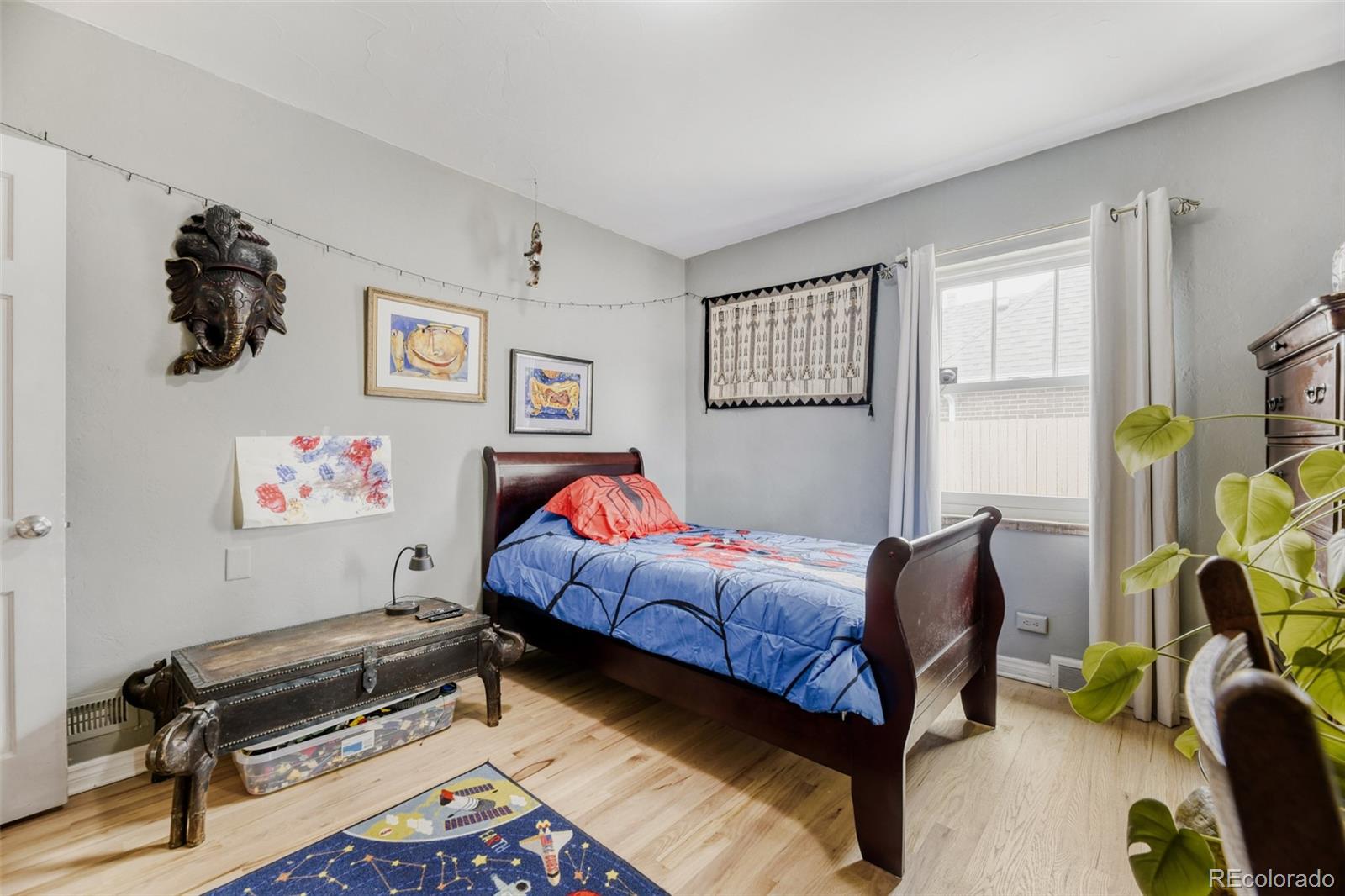 2520 North Locust Street Denver, CO 80207 - Photo 18 of 39 a bedroom with furniture and a window