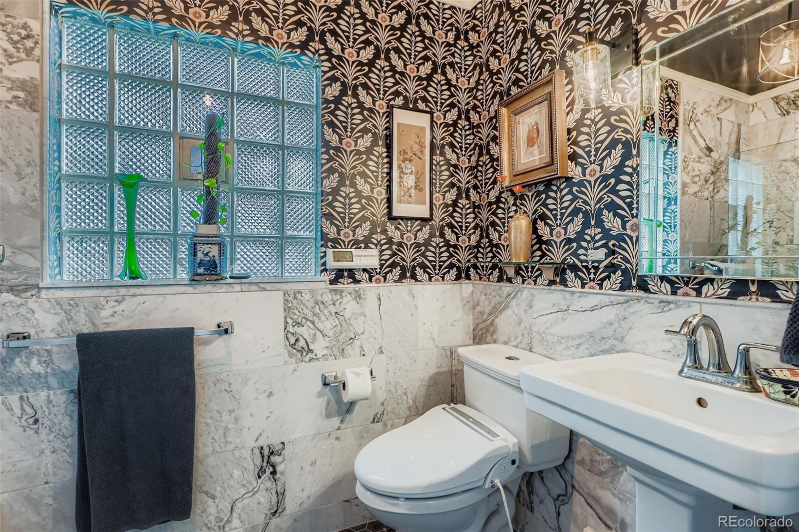 2520 North Locust Street Denver, CO 80207 - Photo 21 of 39 a bathroom with a toilet sink and mirror