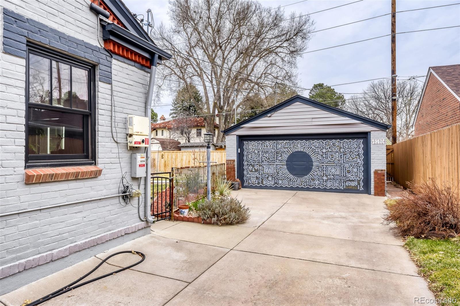 2520 North Locust Street Denver, CO 80207 - Photo 27 of 39 a front view of a house with garden