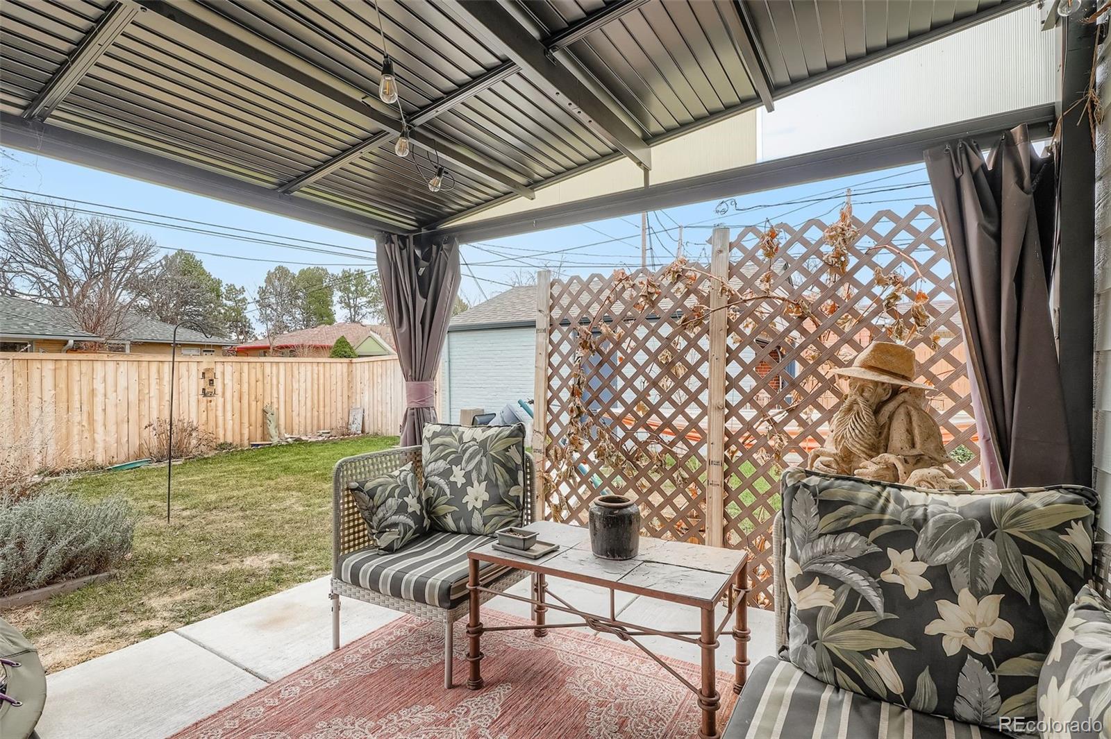 2520 North Locust Street Denver, CO 80207 - Photo 30 of 39 a view of a chairs and table in the patio