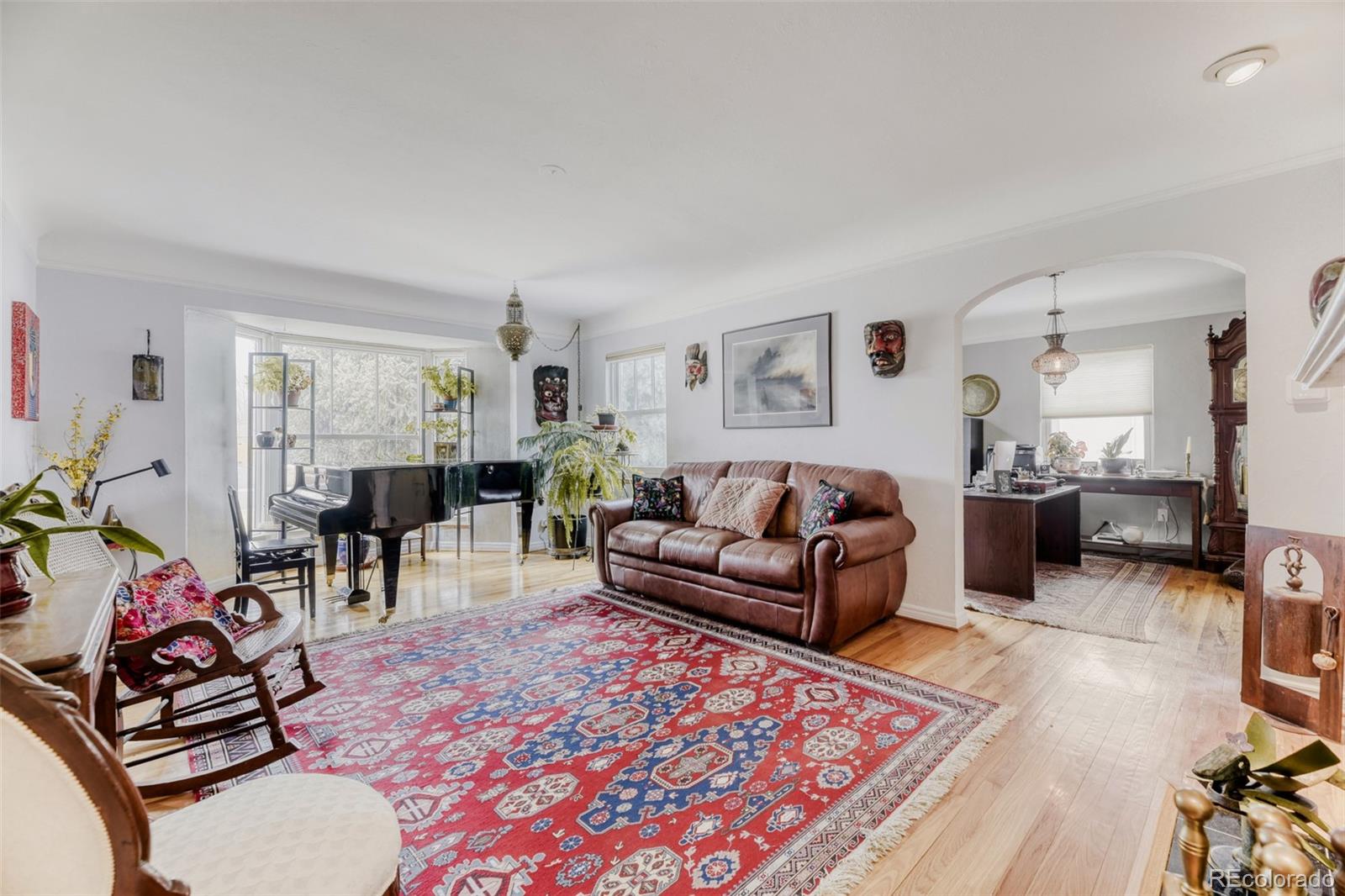 2520 North Locust Street Denver, CO 80207 - Photo 4 of 39 a living room with furniture a rug and a flat screen tv