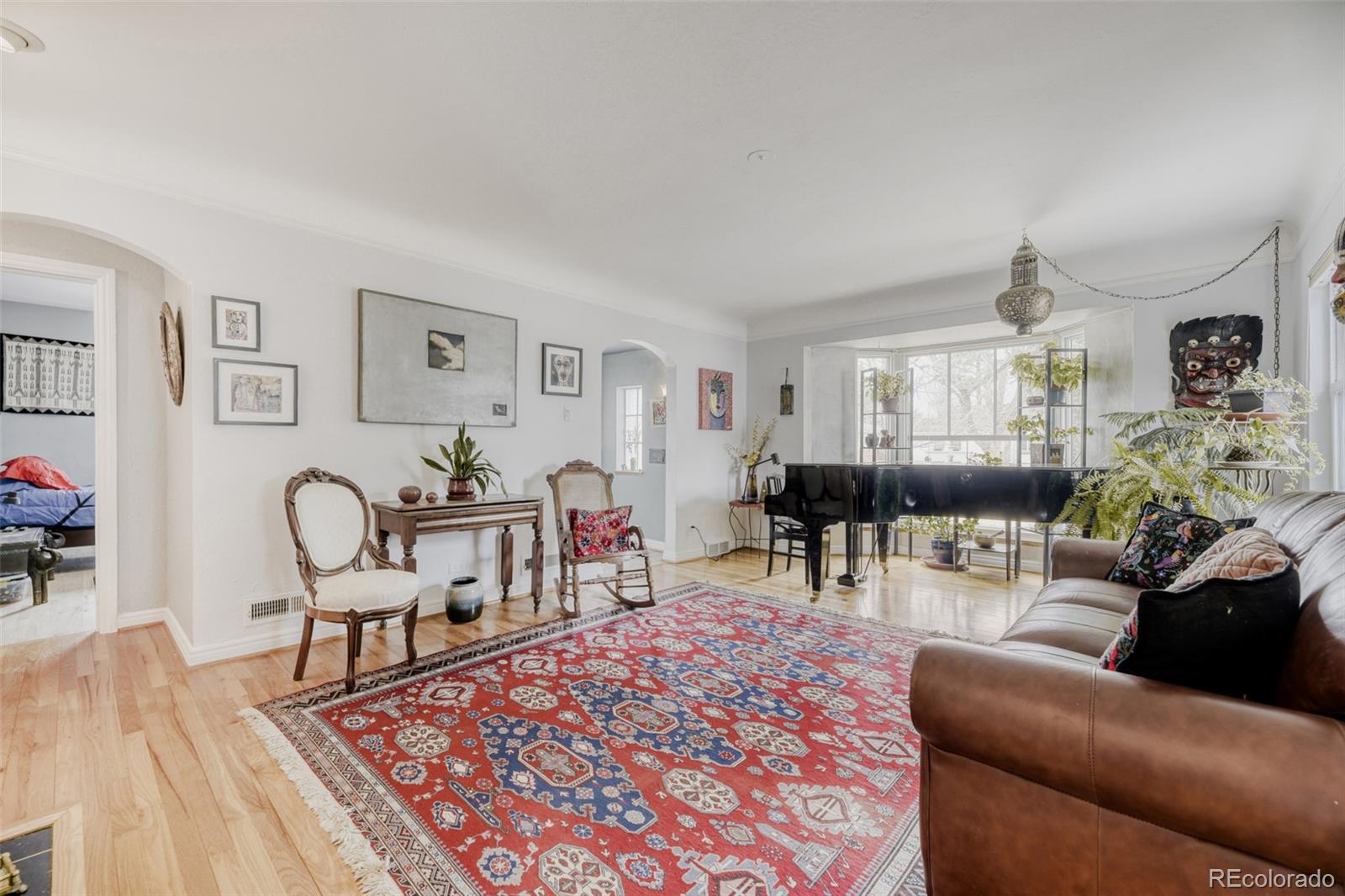 2520 North Locust Street Denver, CO 80207 - Photo 5 of 39 a living room with furniture a rug and a table