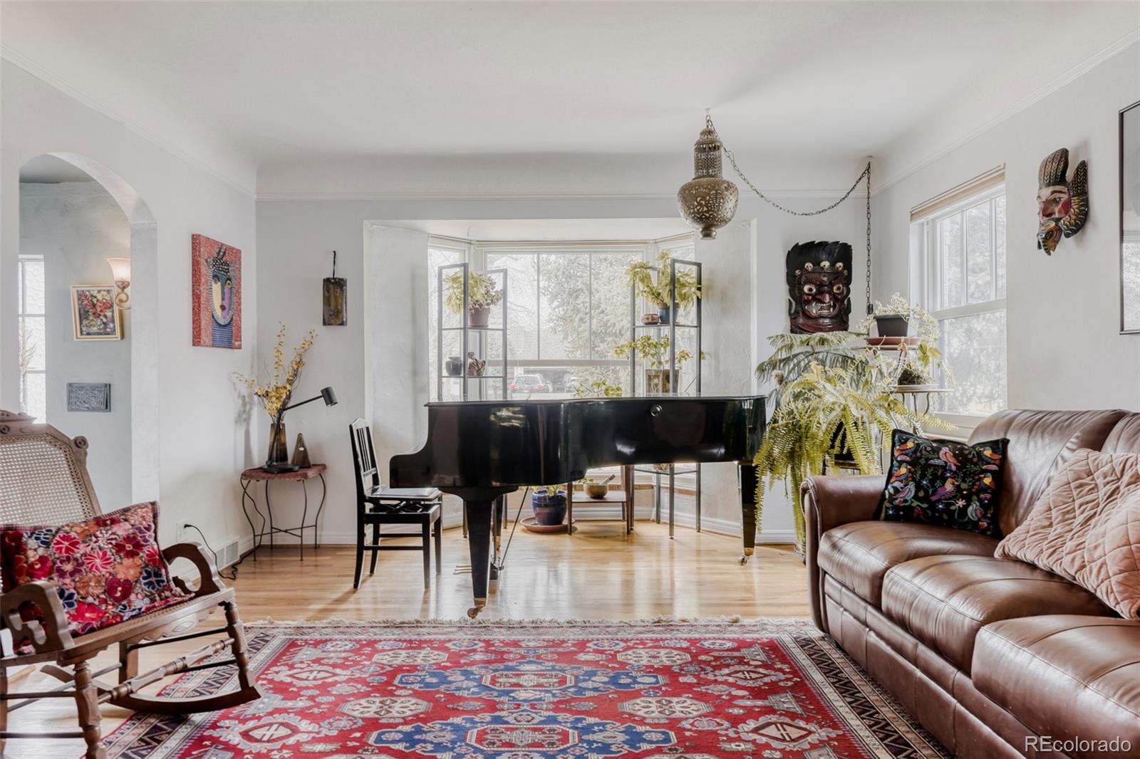 2520 North Locust Street Denver, CO 80207 - Photo 7 of 39 a living room with furniture or couch and a large window
