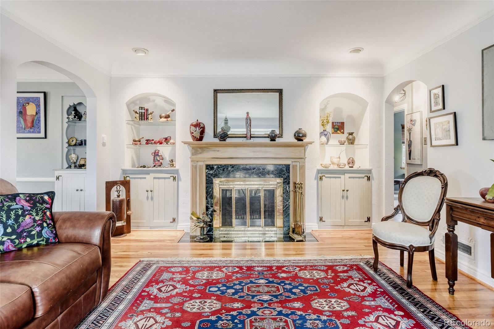 2520 North Locust Street Denver, CO 80207 - Photo 8 of 39 a living room with furniture and a fireplace