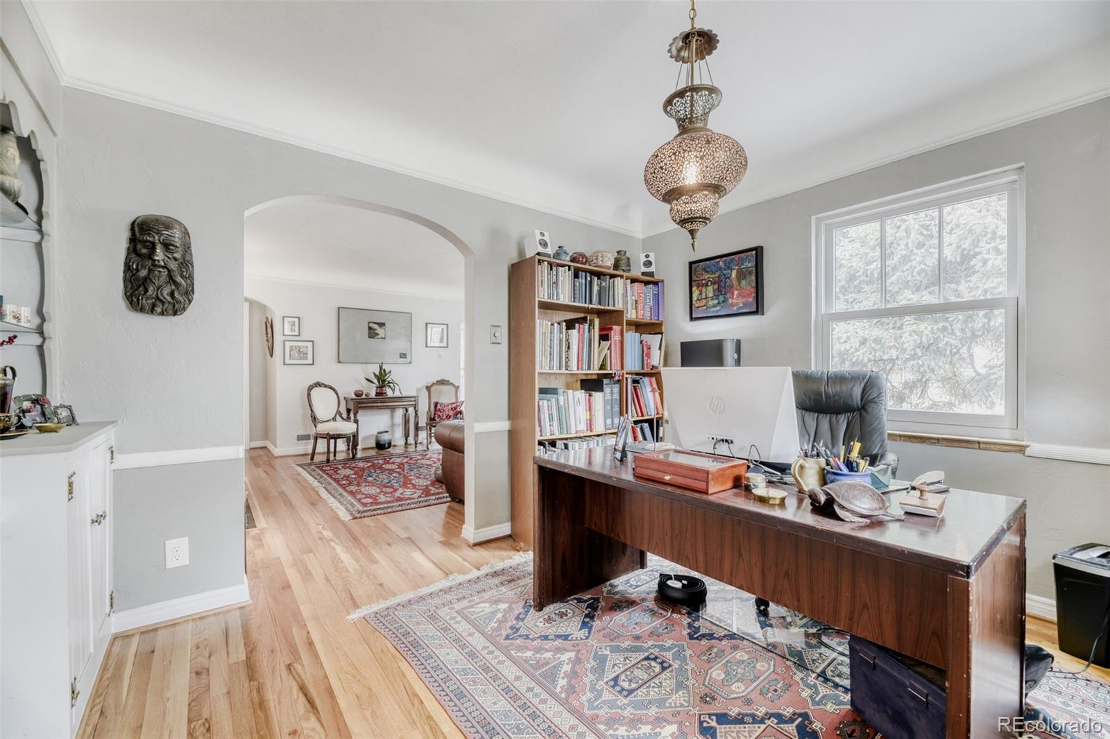 2520 North Locust Street Denver, CO 80207 - Photo 10 of 39 a living room with furniture and a window