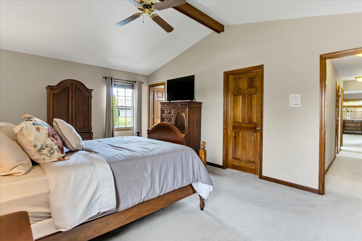 76 Red Fox Run Montgomery, IL 60538 - Photo 16 of 28 a bedroom with a bed and a television