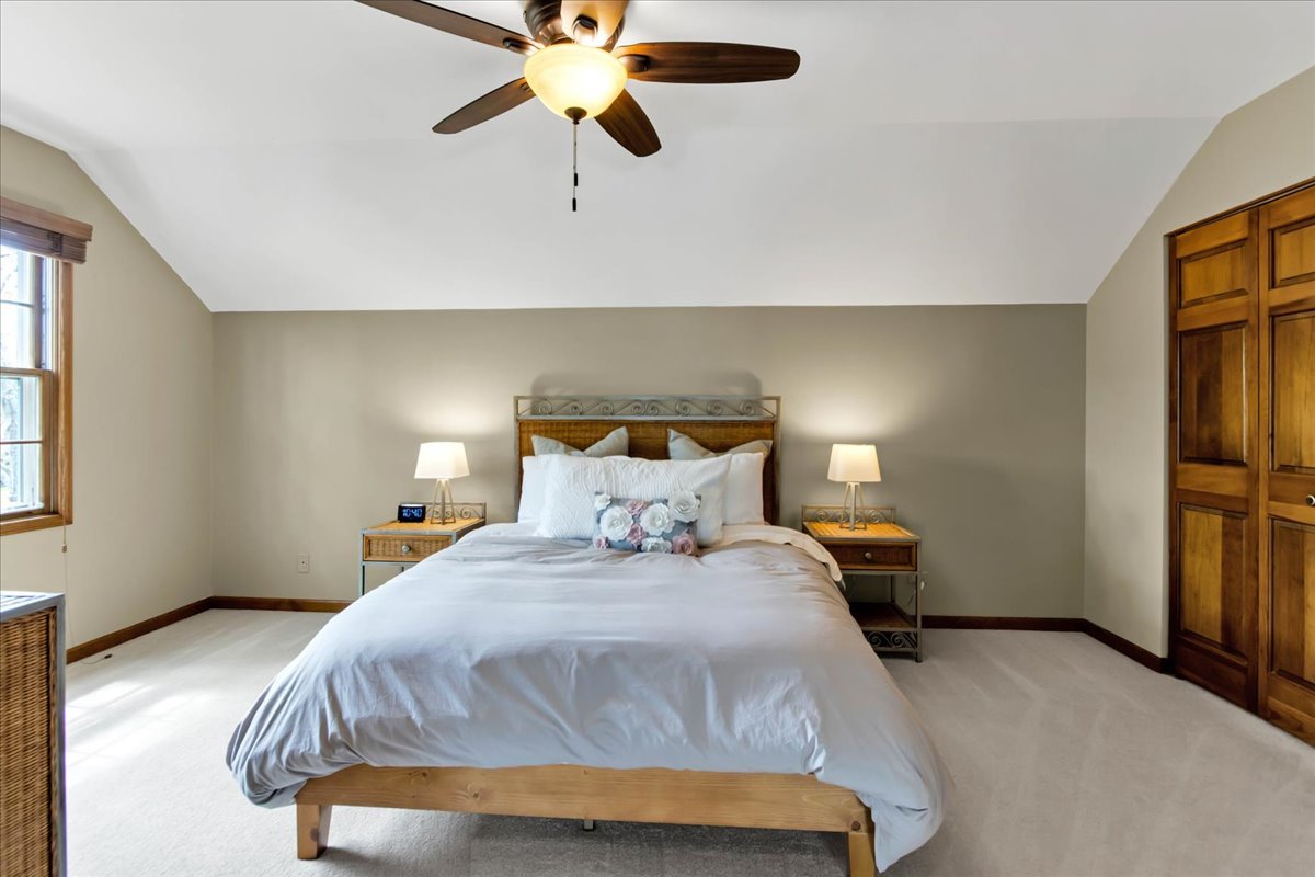 76 Red Fox Run Montgomery, IL 60538 - Photo 18 of 28 a bedroom with a bed and wooden floor