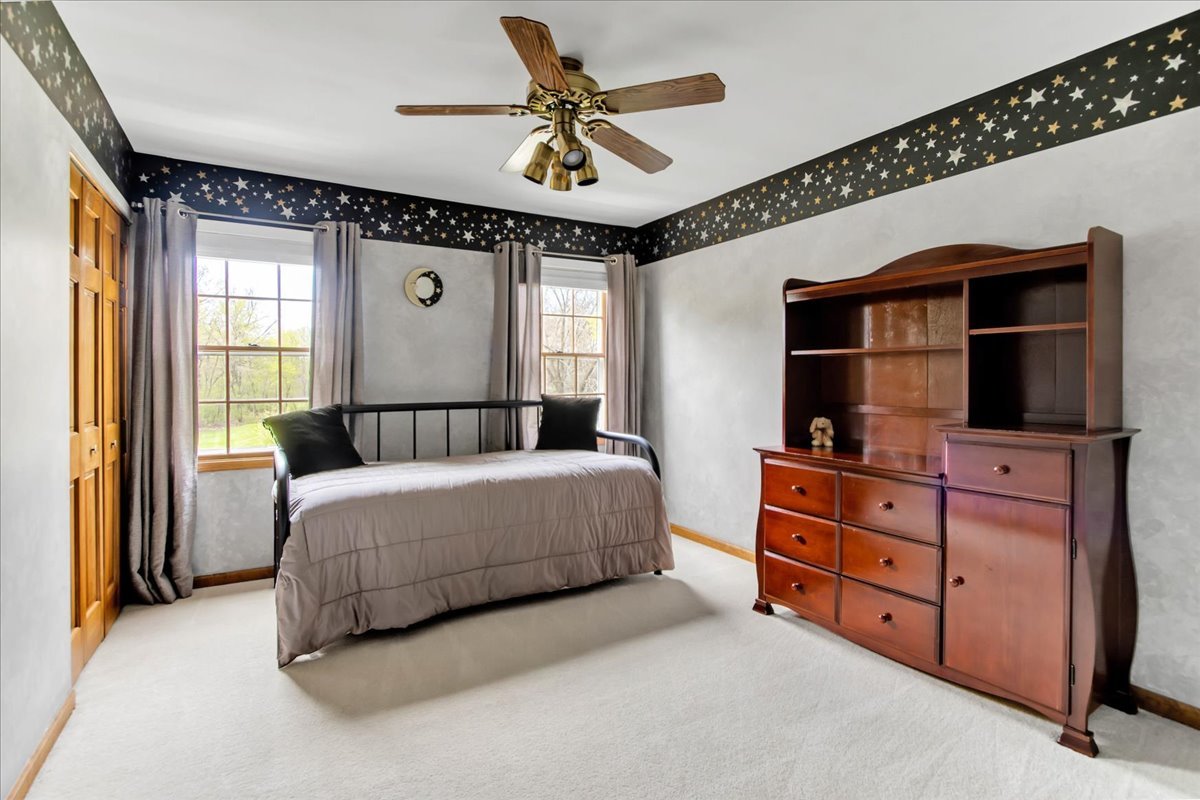 76 Red Fox Run Montgomery, IL 60538 - Photo 21 of 28 a bedroom with a bed dresser and a window