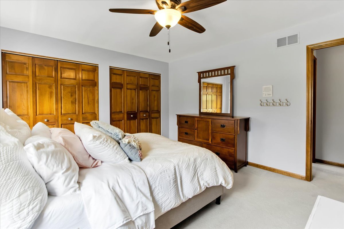 76 Red Fox Run Montgomery, IL 60538 - Photo 24 of 28 a bedroom with a bed and a large window