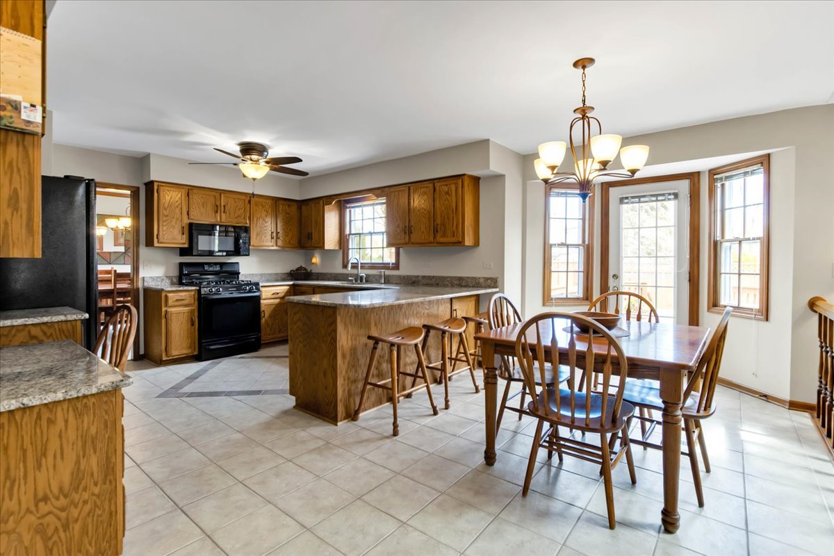 76 Red Fox Run Montgomery, IL 60538 - Photo 10 of 28 a view of a dining room with furniture window and outside view
