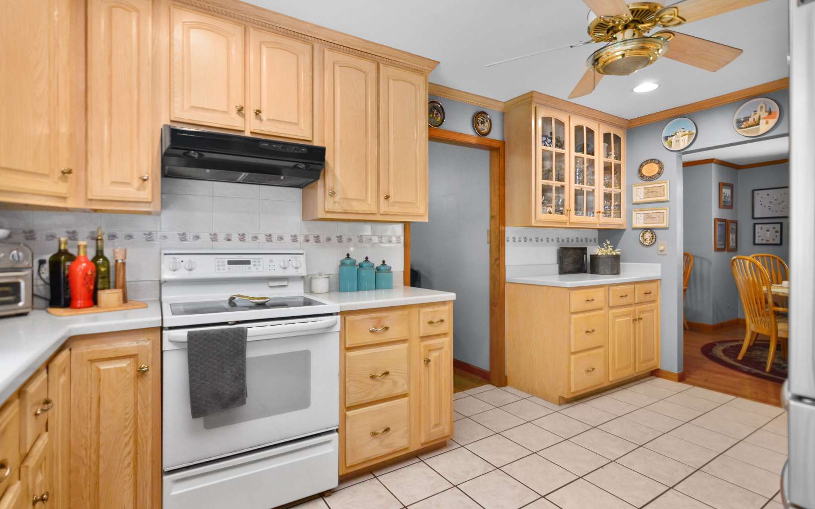 2850 Appalachian Highway Blue Ridge, GA 30513 - Photo 15 of 30 a kitchen with cabinets stainless steel appliances and wooden floor