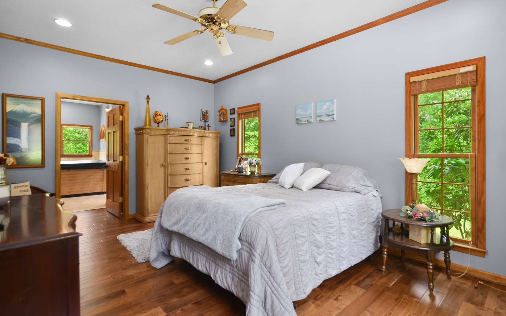 2850 Appalachian Highway Blue Ridge, GA 30513 - Photo 21 of 30 a bedroom with a large bed and a chandelier