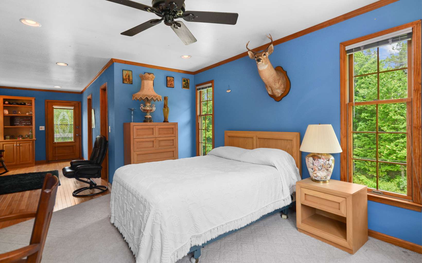 2850 Appalachian Highway Blue Ridge, GA 30513 - Photo 24 of 30 a bedroom with a bed and a chandelier