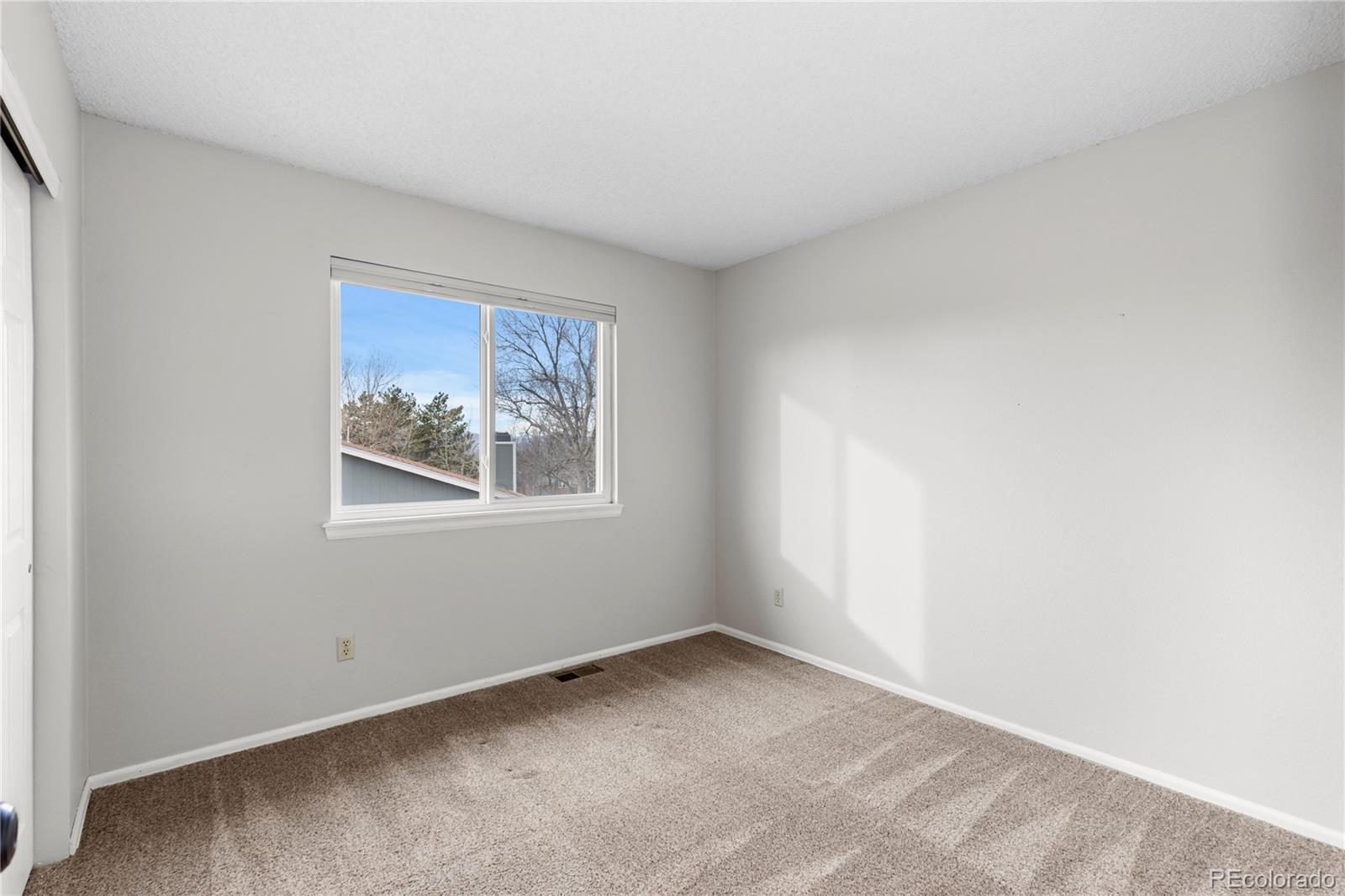 8503 South Woody Way Highlands Ranch, CO 80126 - Photo 33 of 45 a view of an empty room with a window