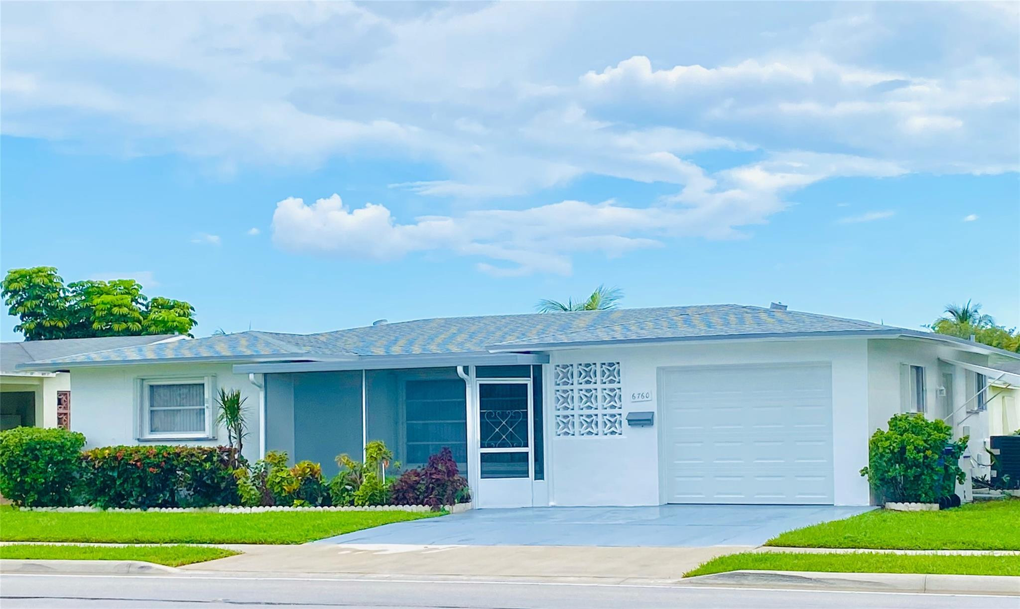 a view of a yard in front of a house