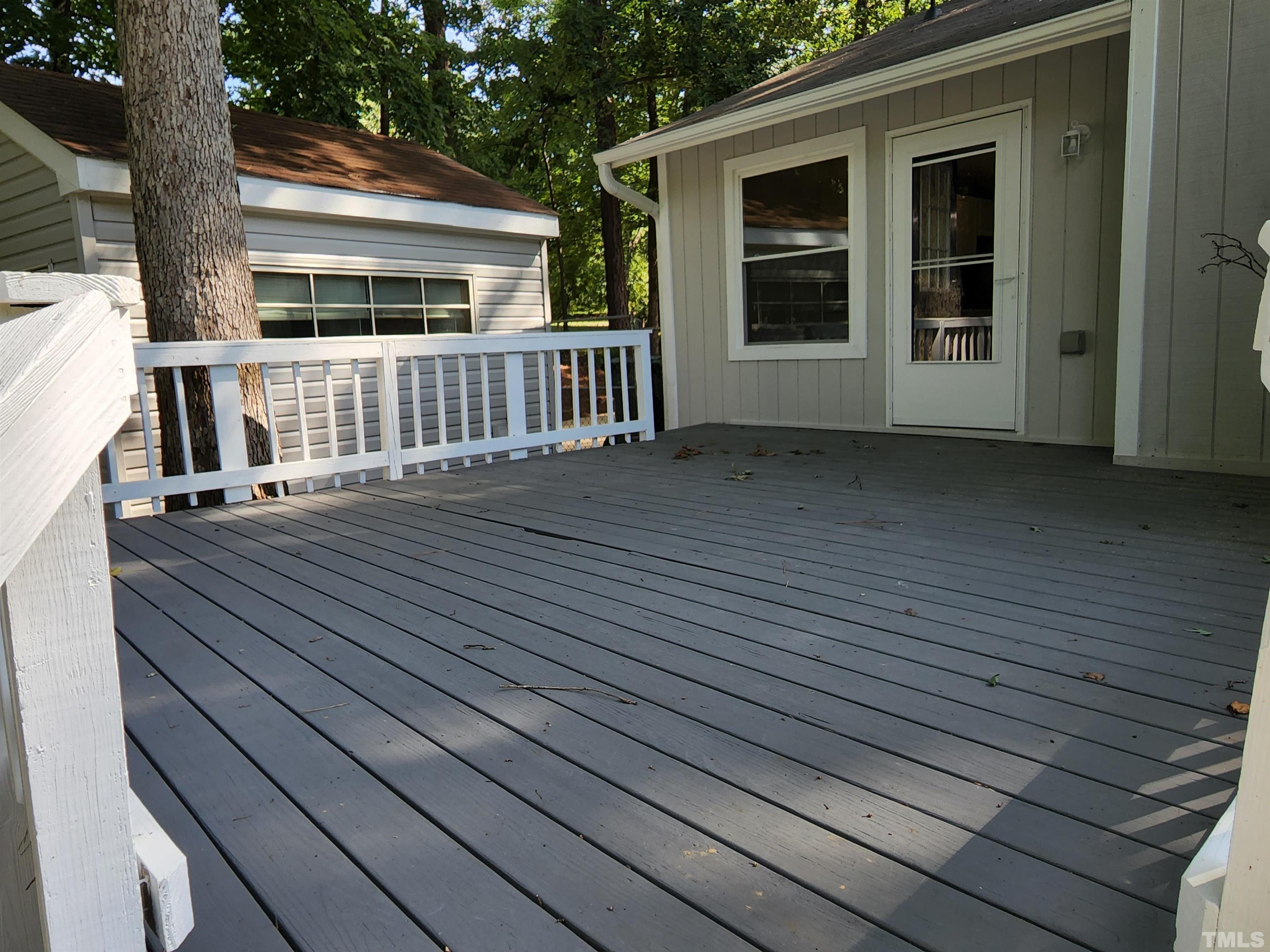 104 Trappers Run Drive Cary, NC 27513 - Photo 11 of 13 a view of a house with wooden deck