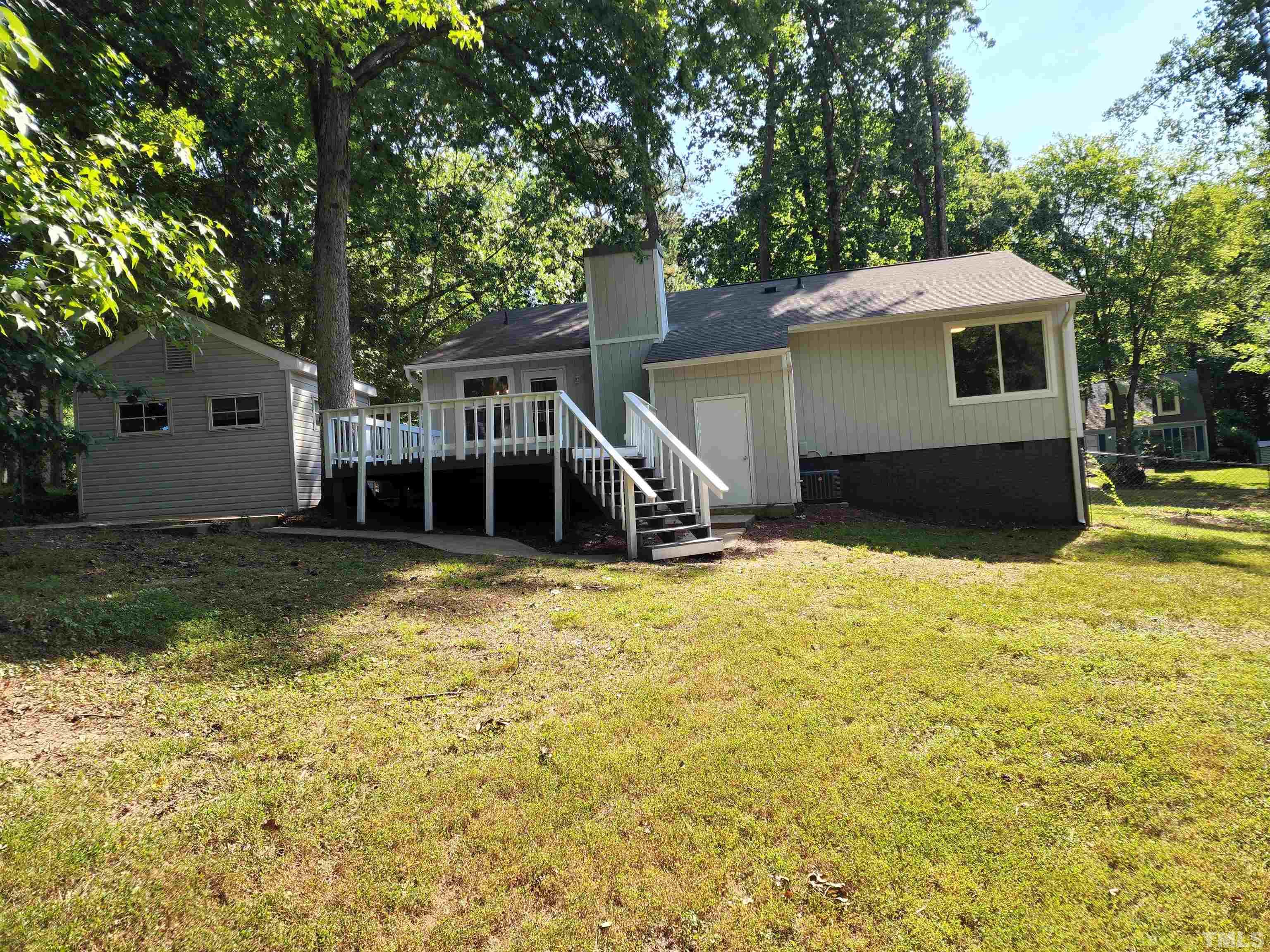 104 Trappers Run Drive Cary, NC 27513 - Photo 12 of 13 a front view of a house with a yard