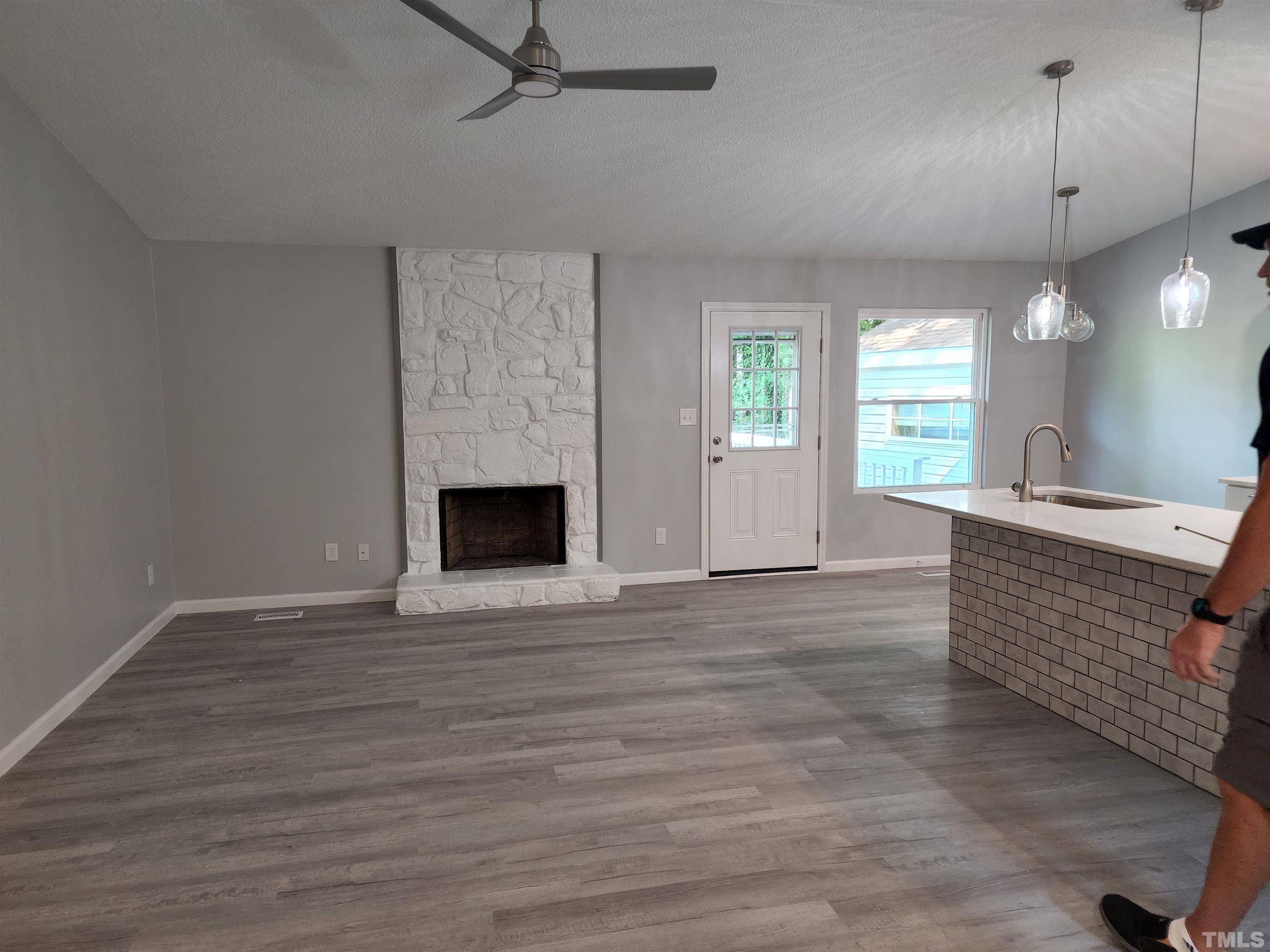 104 Trappers Run Drive Cary, NC 27513 - Photo 5 of 13 an empty room with wooden floor and windows