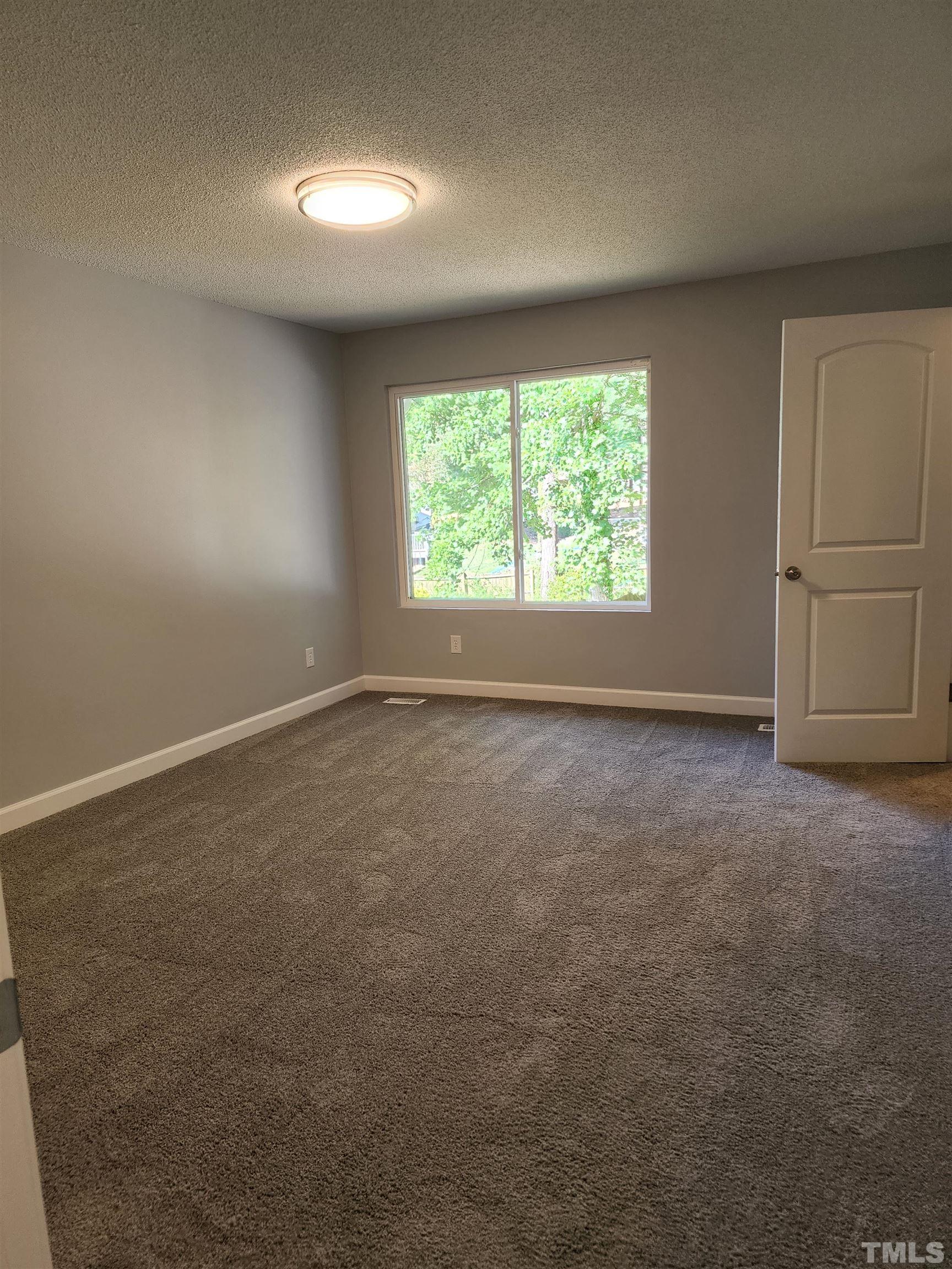104 Trappers Run Drive Cary, NC 27513 - Photo 6 of 13 an empty room with a window