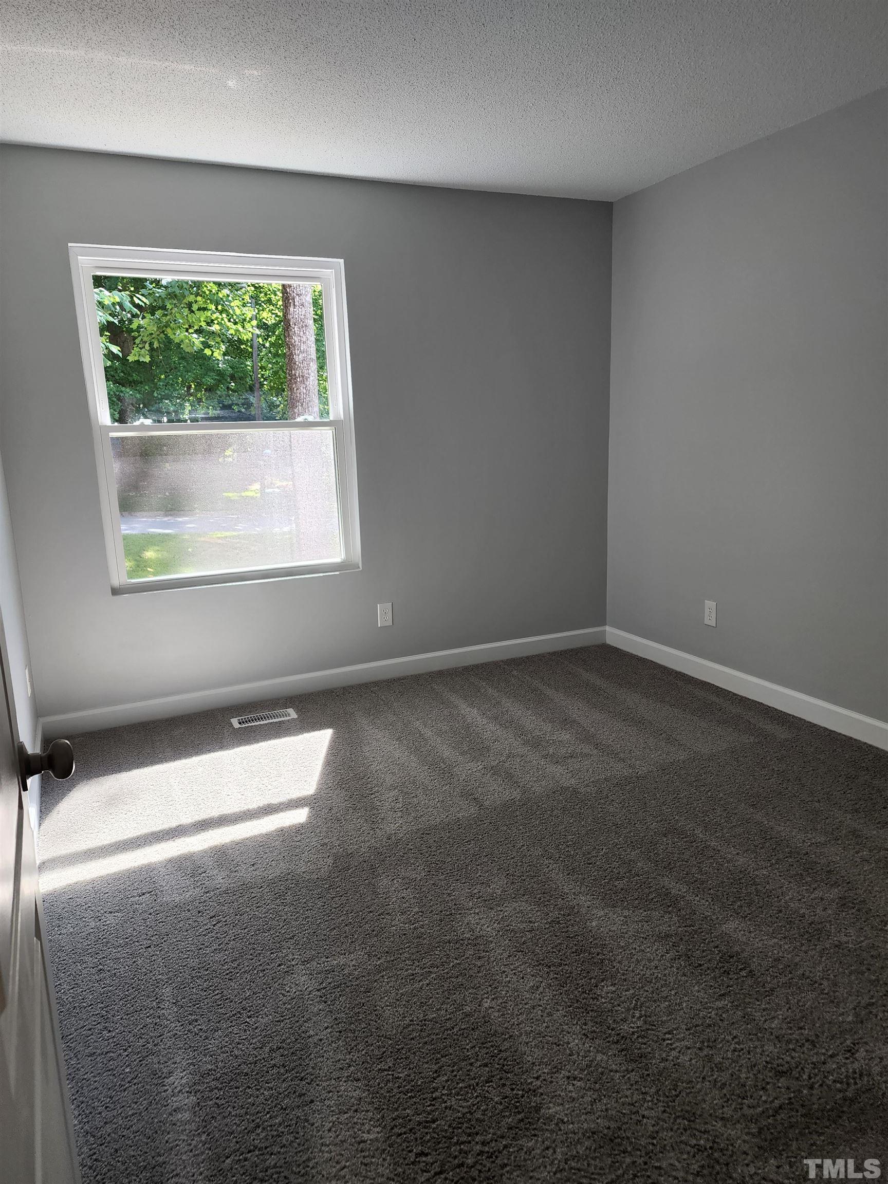 104 Trappers Run Drive Cary, NC 27513 - Photo 8 of 13 an empty room with a window