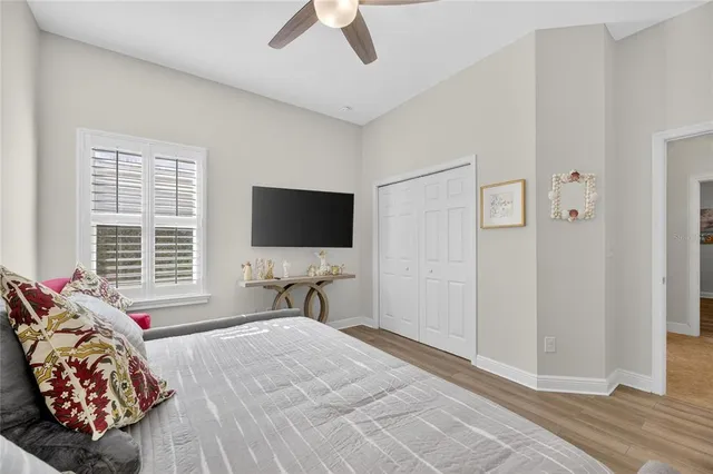 a living room with furniture fireplace and a large window