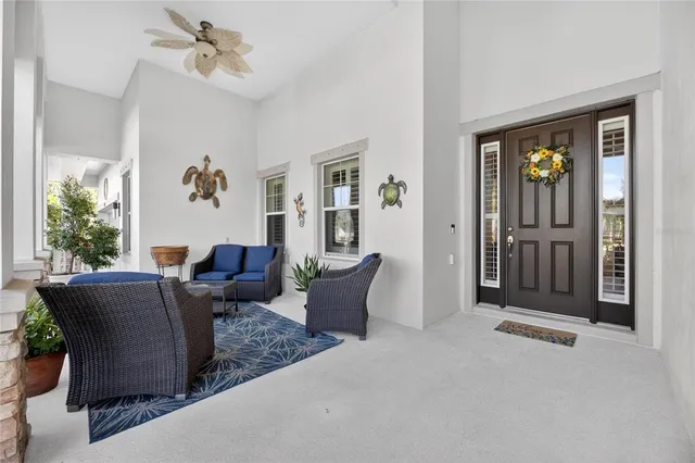 a view of a bathroom with toilet windows and wooden floor