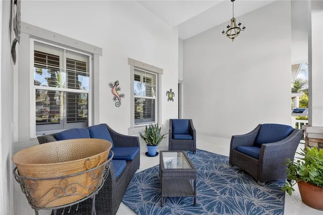 a bathroom with a granite countertop double vanity sink a mirror and a bathtub