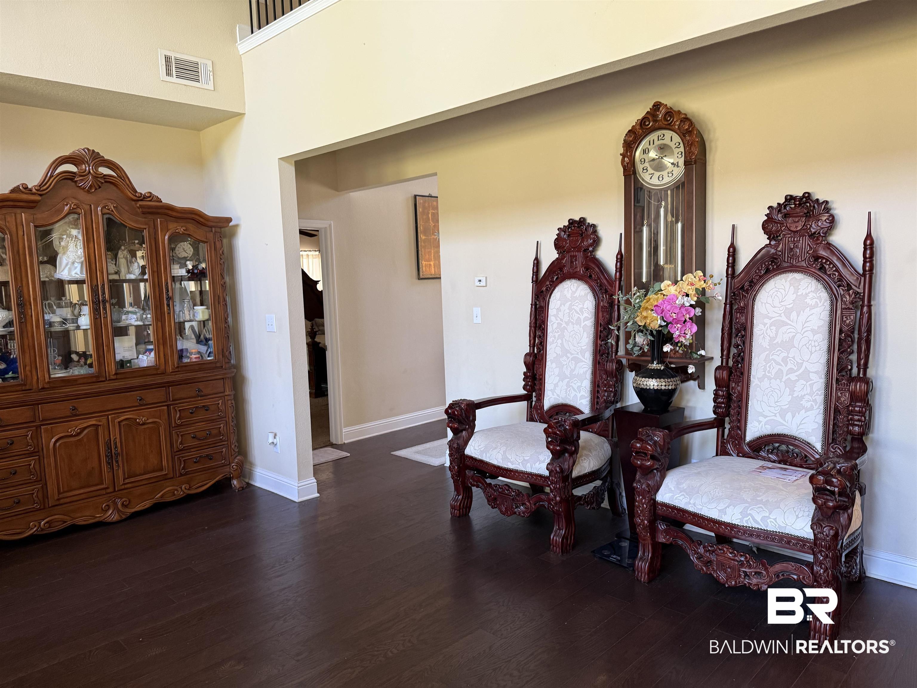 9023 Krystal Ridge Court Daphne, AL 36526 - Photo 41 of 41 Sitting room with dark wood-style flooring and a towering ceiling