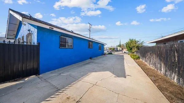 a front view of a house with parking space