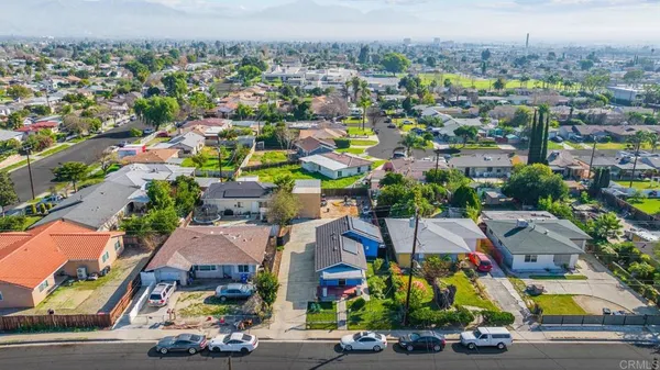 an aerial view of residential houses with outdoor space