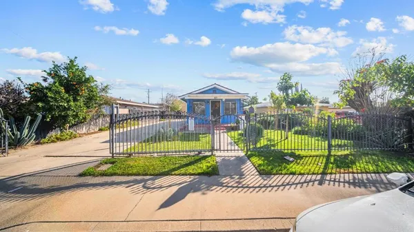 a view of a house with a yard and plants