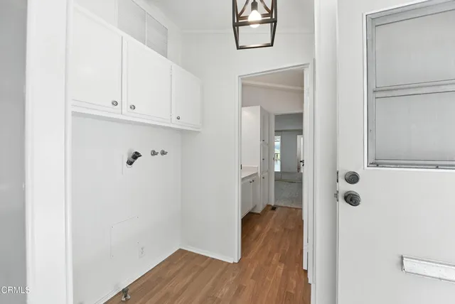 a view of a bathroom with wooden floor