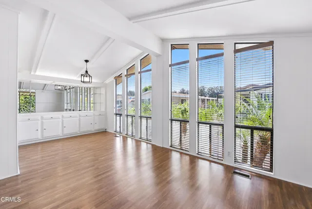 a view of an entryway with wooden floor