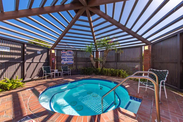 a view of a swimming pool with a patio
