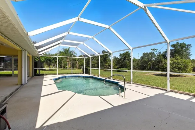 a view of swimming pool with seating area