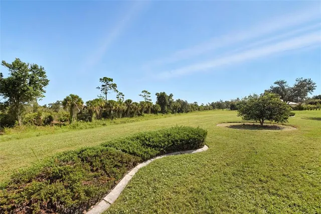 a view of a lake with a yard