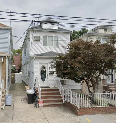 a view of a house with a window and stairs