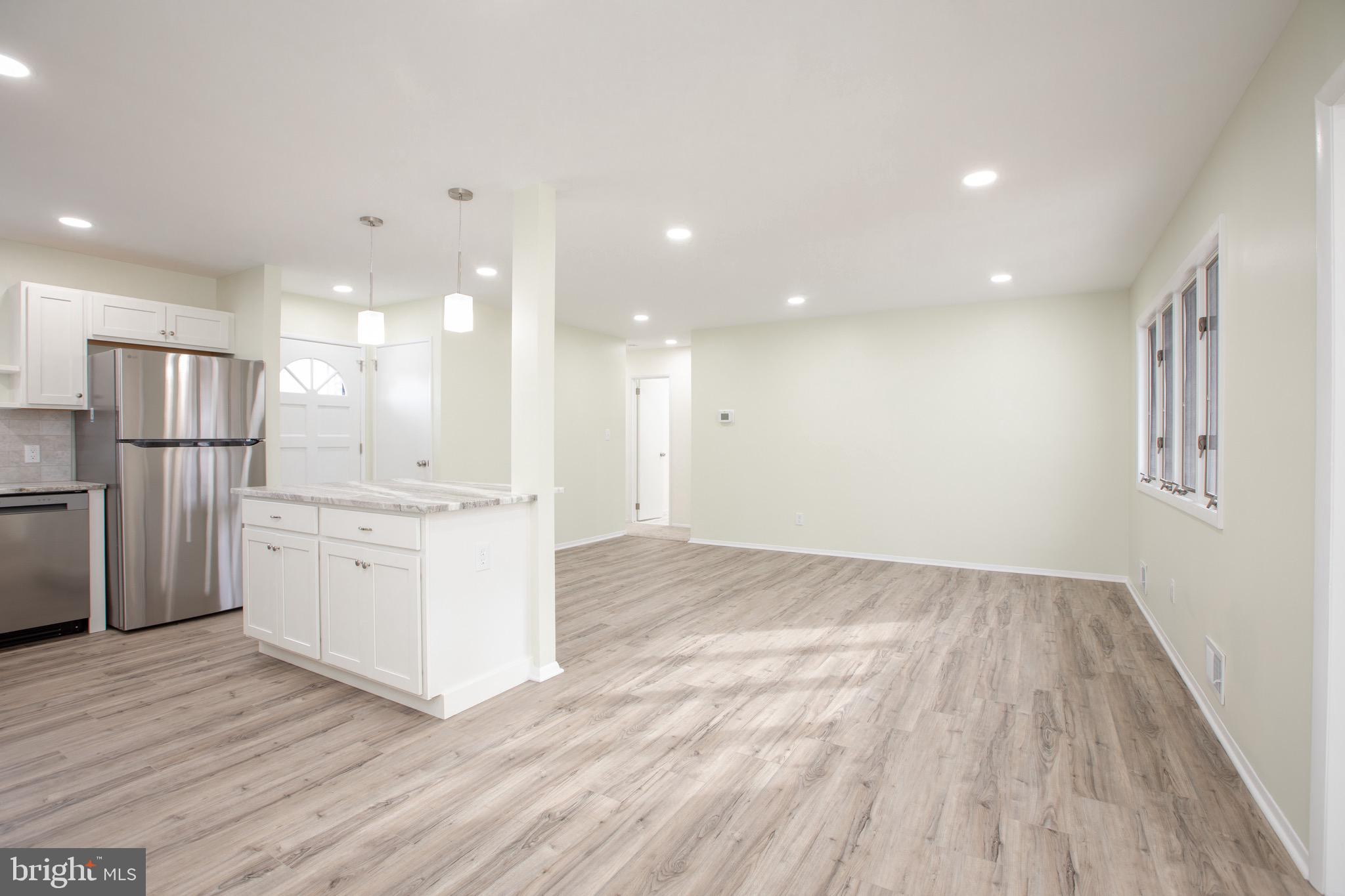 21 Rolling Lane Hamilton, NJ 08690 - Photo 17 of 40 a view of kitchen with wooden floor and electronic appliances