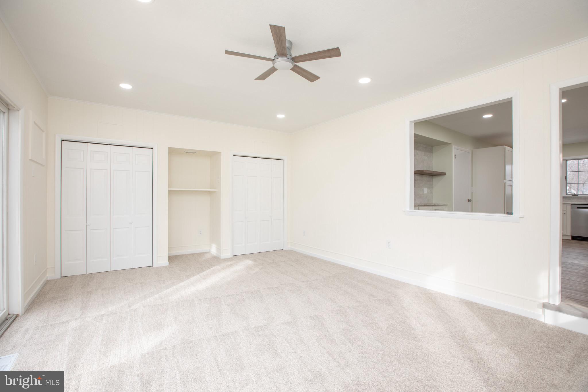 21 Rolling Lane Hamilton, NJ 08690 - Photo 20 of 40 an empty room with ceiling fan and windows