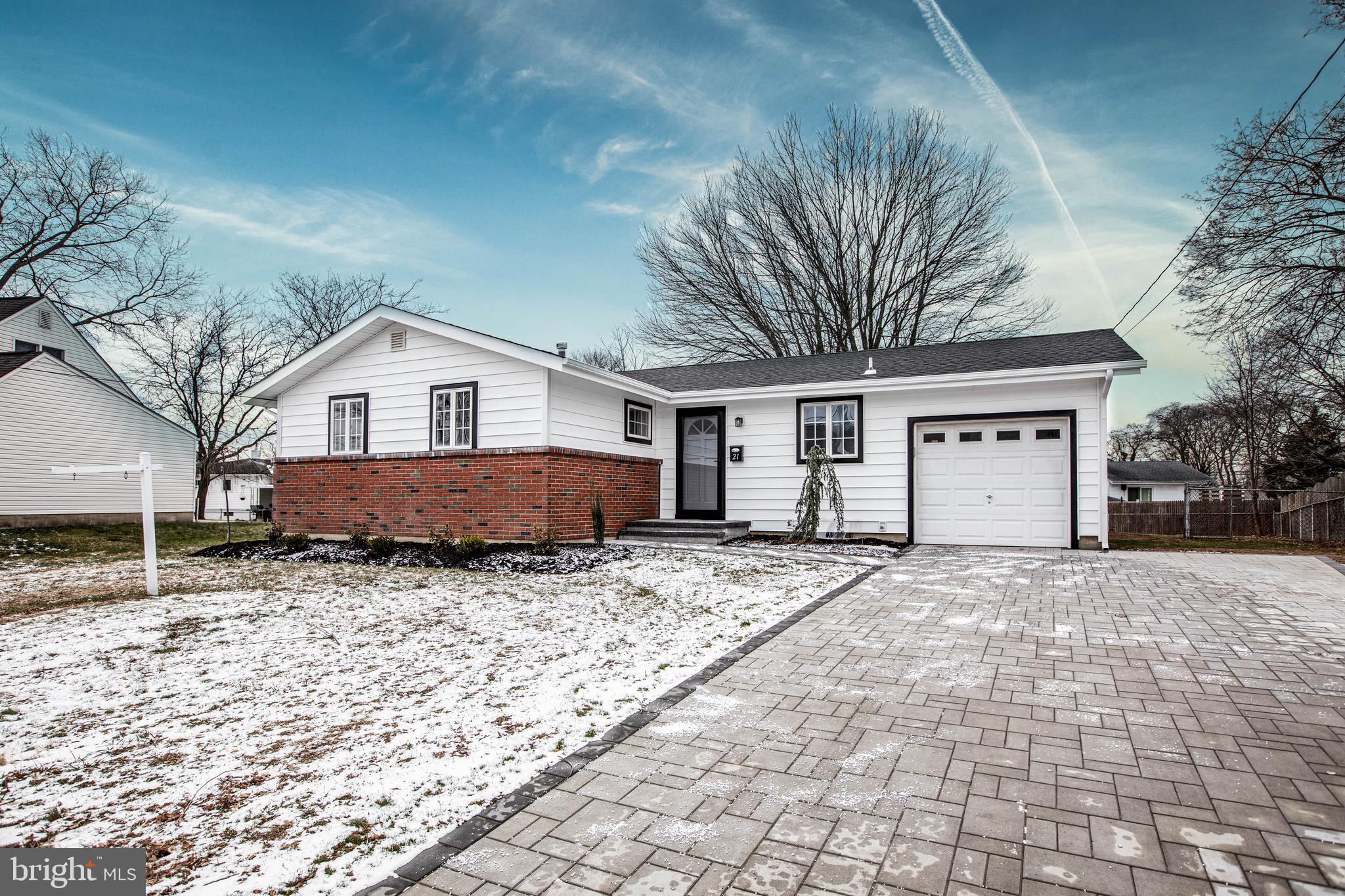 21 Rolling Lane Hamilton, NJ 08690 - Photo 2 of 40 a house with trees in the background