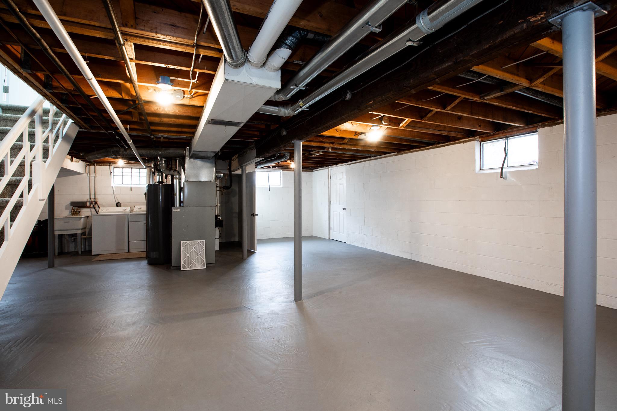 21 Rolling Lane Hamilton, NJ 08690 - Photo 31 of 40 a view of water heater room with stairs