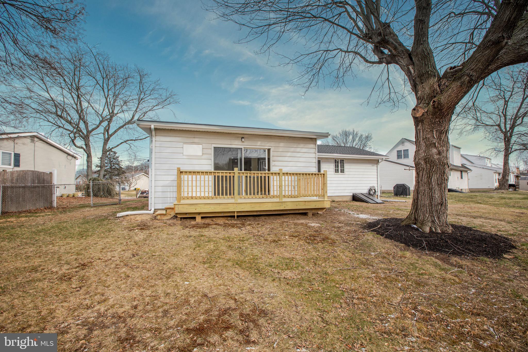 21 Rolling Lane Hamilton, NJ 08690 - Photo 36 of 40 a house with trees in front of it