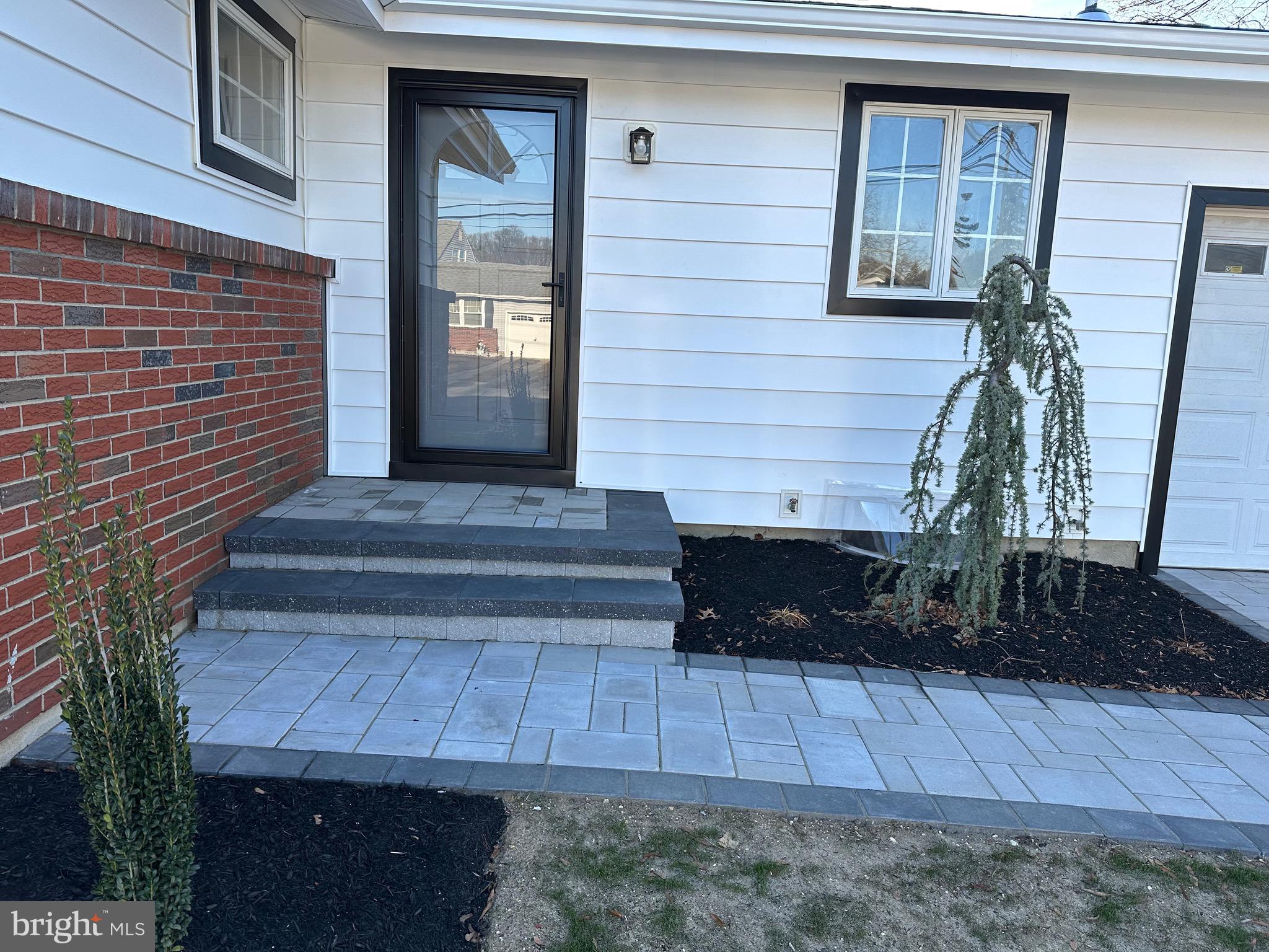 21 Rolling Lane Hamilton, NJ 08690 - Photo 6 of 40 a front view of a house with a yard