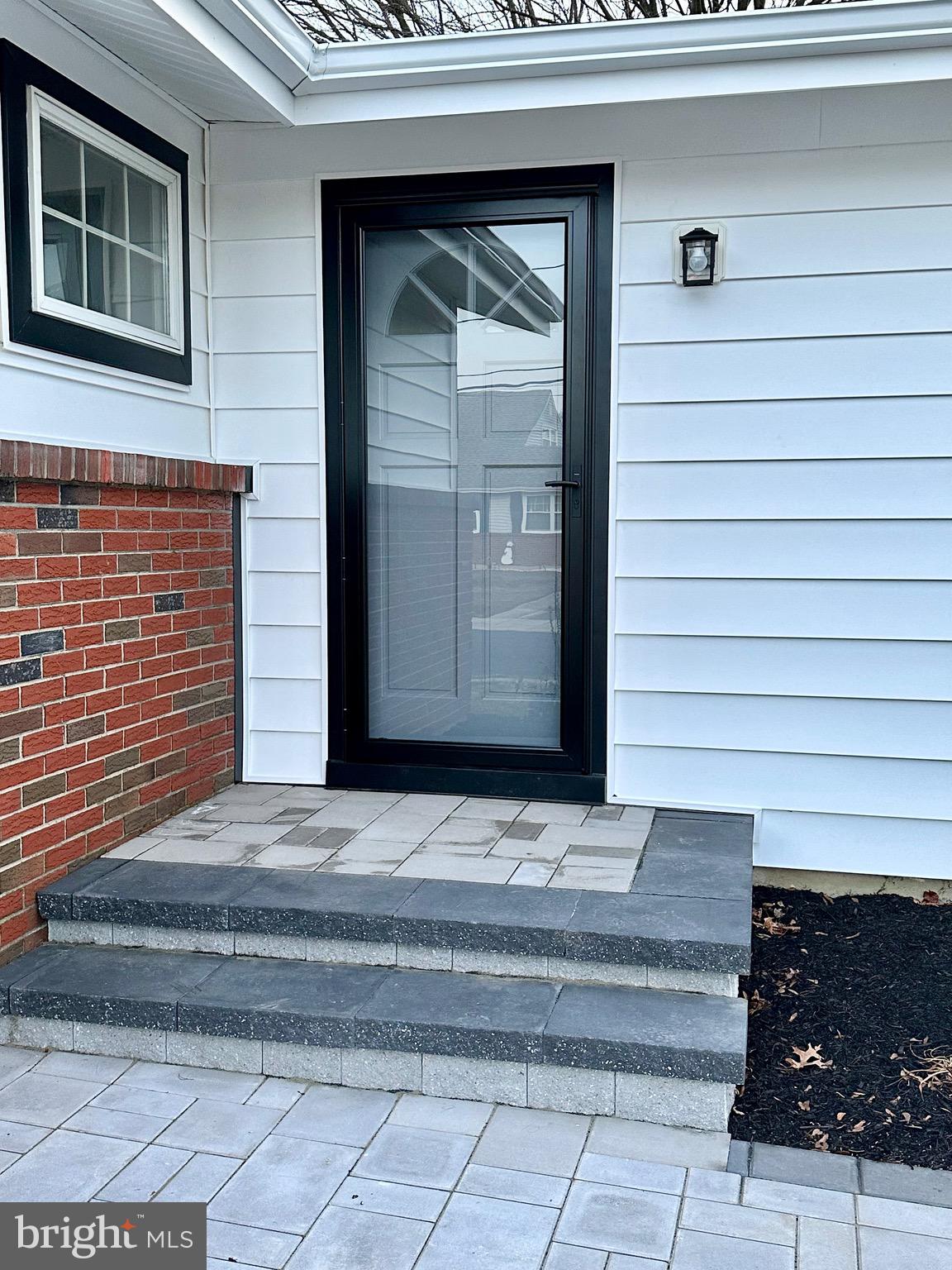 21 Rolling Lane Hamilton, NJ 08690 - Photo 8 of 40 a view of entrance door of the house